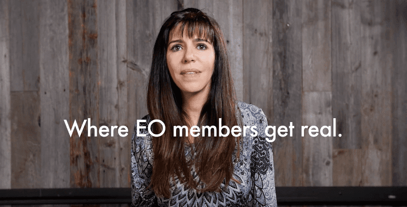 An EO member looking at the camera with the words "Where EO members get real" on the screen
